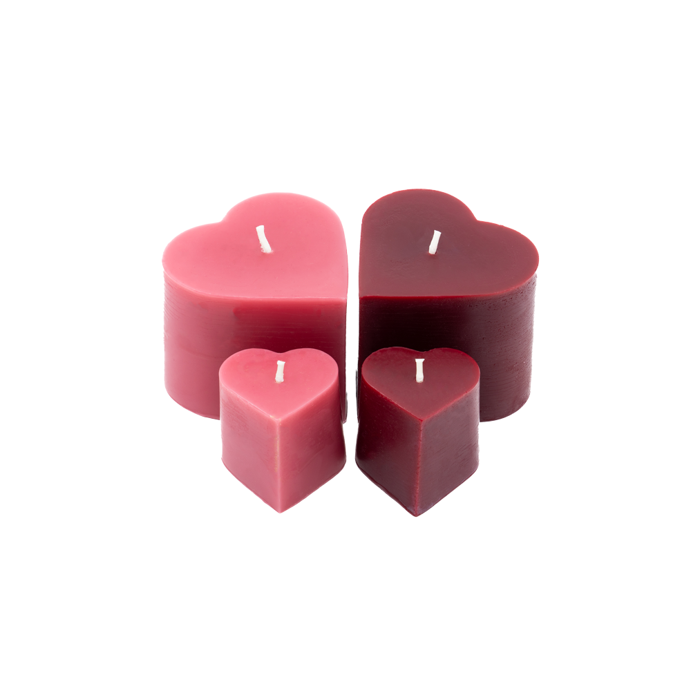 Set of Sunbeam Candles pure beeswax red & pink heart-shaped candles in various sizes on a white background.