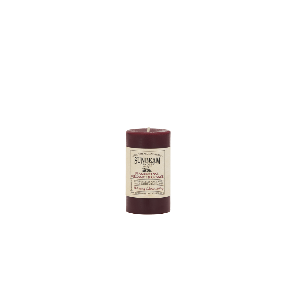 Sunbeam Candles pure burgundy Beeswax Frankincense Bergamot & Orange 2"x3.25" pillar candle on a white background