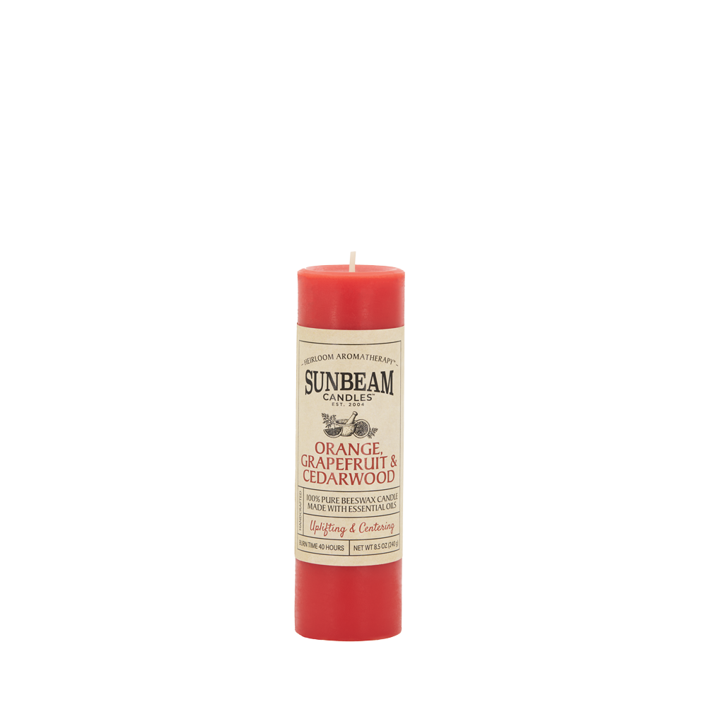 Sunbeam Candles Pure Beeswax reddish-orange Orange, Grapefruit & Cedarwood 2"x6.25" pillar candle with white background