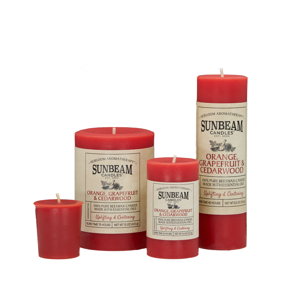 Sunbeam Candles Pure Beeswax reddish-orange Orange, Grapefruit & Cedarwood pillar and votive candles with white background