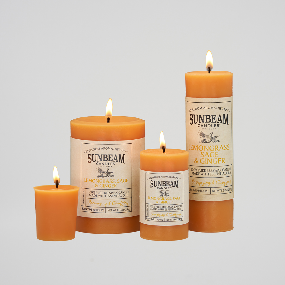 Sunbeam Candles Pure Beeswax saffron Lemongrass, Sage & Ginger lit pillar and votive candles with white background