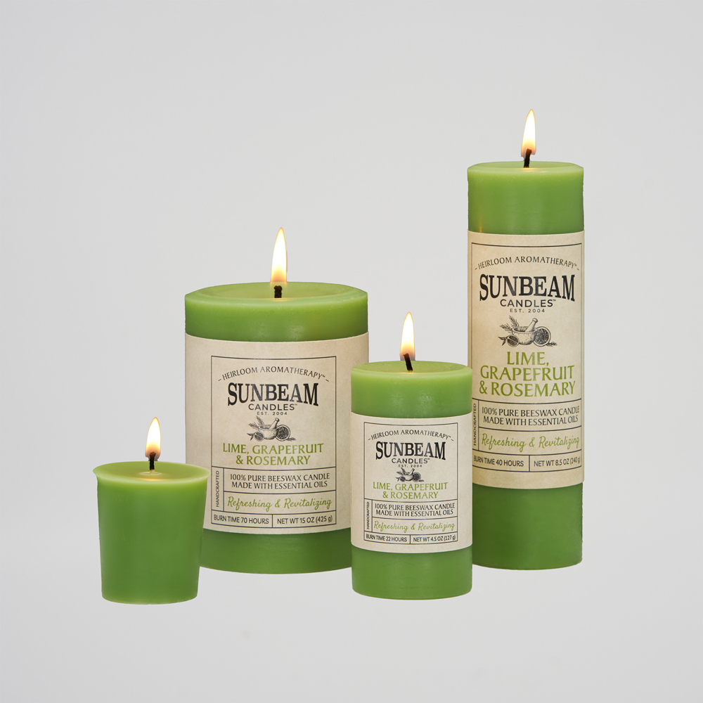 Sunbeam Candles Pure Beeswax Sage Green - Lime, Grapefruit & Rosemary lit pillars and votive candles with white background