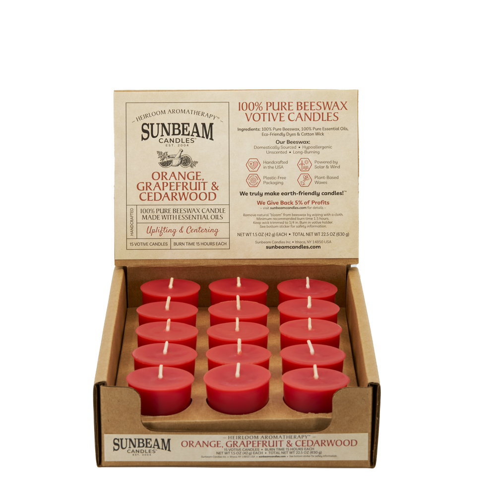 Sunbeam Candles Pure Beeswax reddish-orange Orange, Grapefruit & Cedarwood votive candles in a 15-ct cardboard case with white background