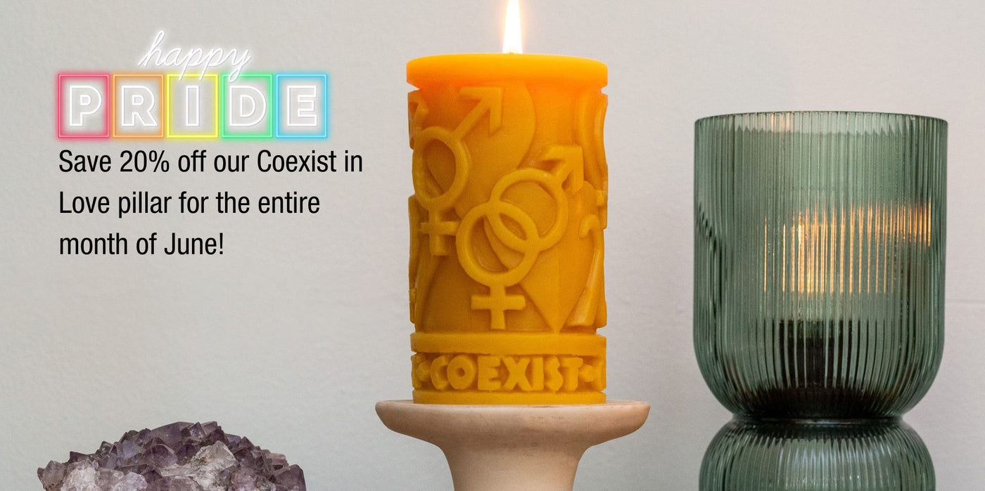 Coexist in love pillar placed on a ceramic stand with amethyst and other decor accents