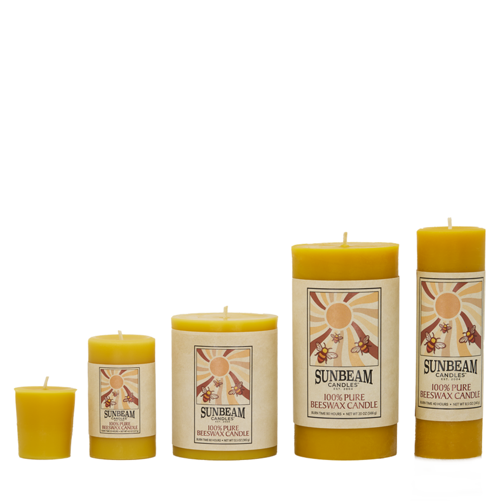 Sunbeam Candles Smooth Beeswax Pillars in four sizes and a votive with a white background.