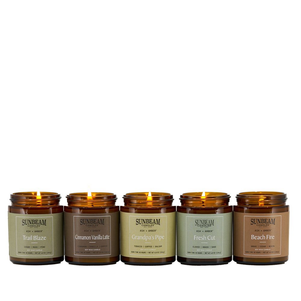 Sunbeam Candles Ash + Amber Everyday Scent Soy Wax candle jars lit on a white background 